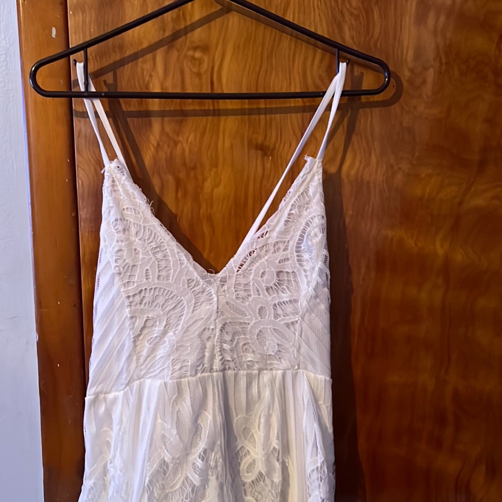 White lace floral criss cross backless romper.